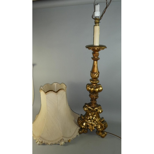 67 - An Ornate Gilt Tall Table Lamp and Shade on Tripod Base, Lamp 96cm high