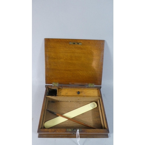 6 - An Edwardian Oak Writing Box with Hinged Lid to Fitted Interior, Brass Escutcheon, 25cm Wide