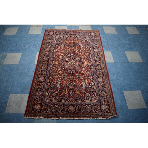 83 - An Antique Persian Hand-Made Keshan Rug, 205 x 130cms