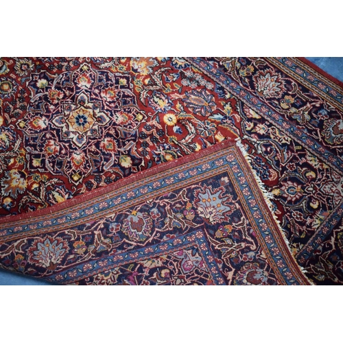 83 - An Antique Persian Hand-Made Keshan Rug, 205 x 130cms