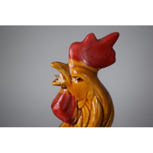 245 - A Continental Glazed Terracotta Study of a Cockerel, 31cms High