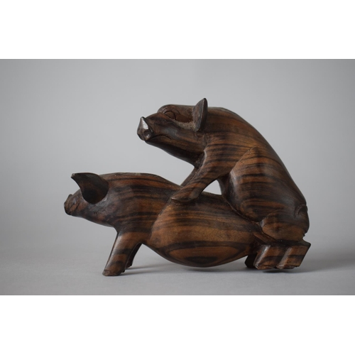 6 - A Carved Wooden Study of Pigs Fornicating, 16cms Wide