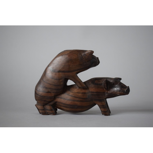 6 - A Carved Wooden Study of Pigs Fornicating, 16cms Wide