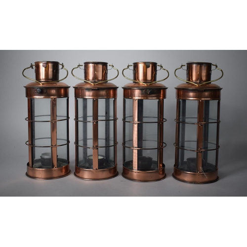 126 - A Collection of Four Copper Lantern Tealight Holders, Each 27cms High