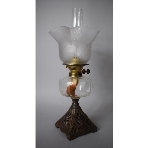 125 - A Late Victorian Oil Lamp with Pierced Cast Iron Base Complete with Chimney and Shade Decorated with... 