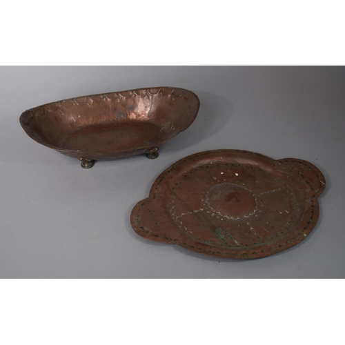96 - An Arts and Crafts Copper Oval Shallow Boat Dish with Hand Beaten Decoration 27cms Wide Together wit... 