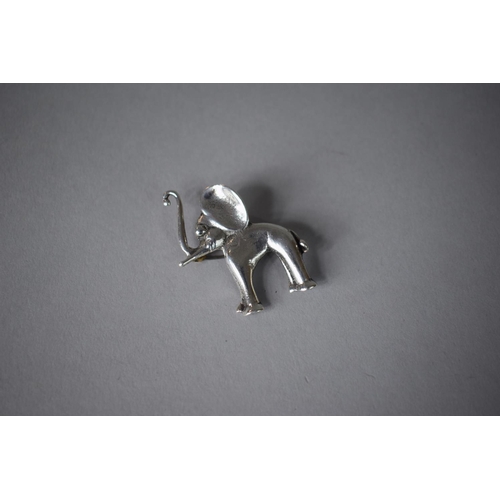 210 - A Novelty Silver Brooch in the Form of Young Elephant with Trunk in Salute, 4.5cms High