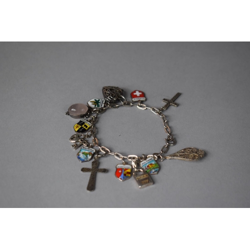 211 - A Small Silver Charm Bracelet with Enamelled Souvenir Shield Charms Etc, 24gms