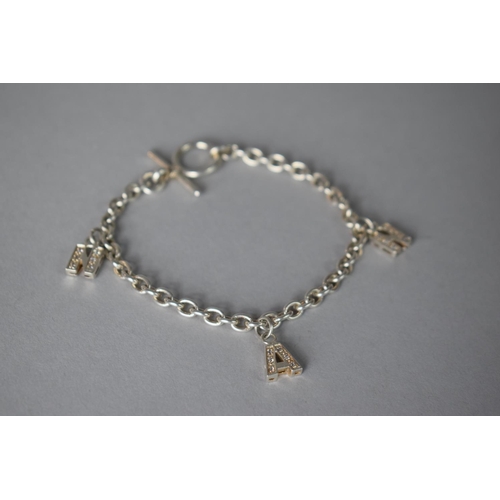 212 - A Silver Bracelet with 3 Jewelled Charms Spelling Nan, 16.3gms