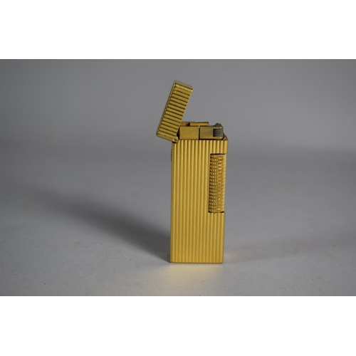 219 - A Dunhill Gold Plated Lighter with Ribbed Body