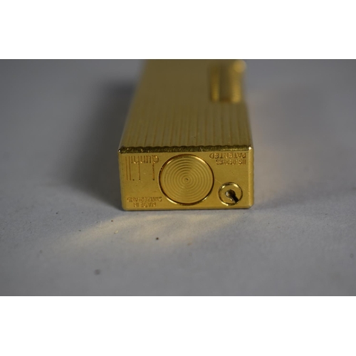 219 - A Dunhill Gold Plated Lighter with Ribbed Body