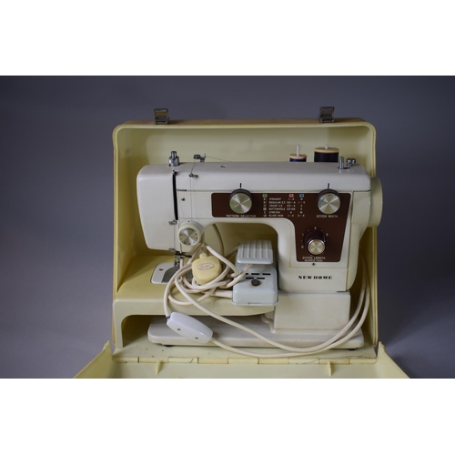 344 - An Electric New Home Sewing Machine with Foot Pedal