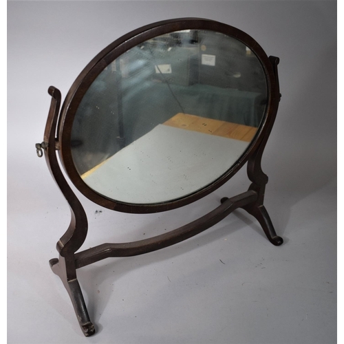 15 - An Edwardian Mahogany Framed Oval Dressing Table Mirror, 51cms Wide