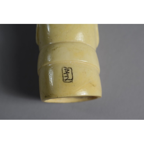 220 - An Early 20th Century Carved Ivory Cane Handle in the Form of Gent Wearing Bow Tie, Signed 3cms High