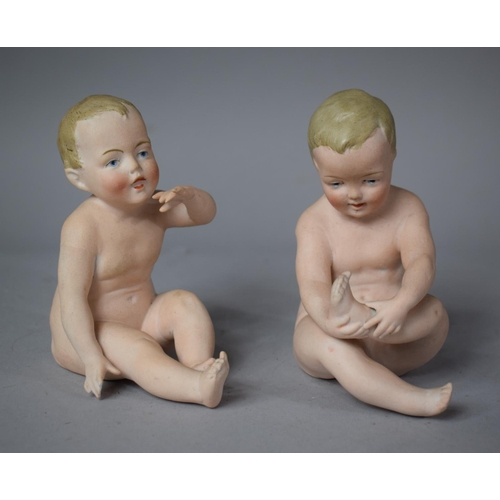 171 - A Pair of Continental Bisque Porcelain Nude Piano Babies, 10cm High