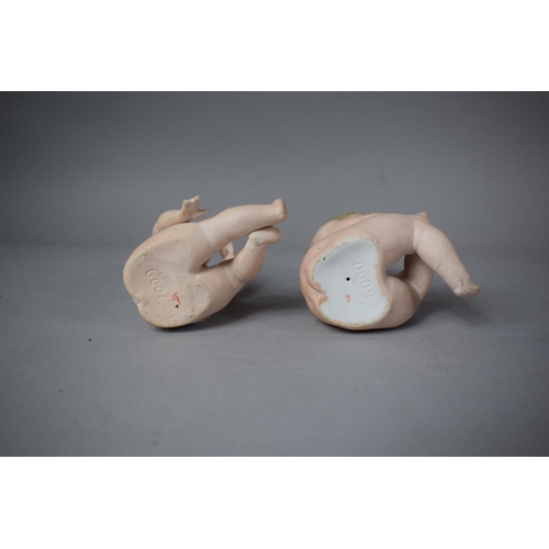 171 - A Pair of Continental Bisque Porcelain Nude Piano Babies, 10cm High
