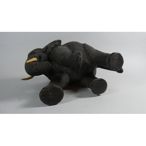 77 - A Carved Wooden Elephant, 22cm High