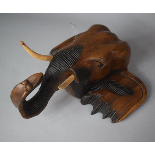 78 - A Wall Hanging Carved Wooden Elephant Head, 33cm high