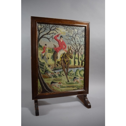 221 - A Tapestry Fire Screen Depicting Huntsman