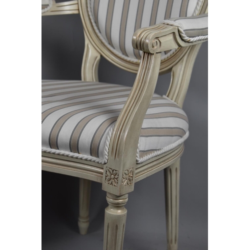 516 - A Pair of French Style Cream Painted Salon Armchairs with Serpentine Fronts and Striped Upholstery