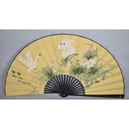 101 - A Large Modern Oriental Fan Decorated with Swans in Reeds, 76cm long