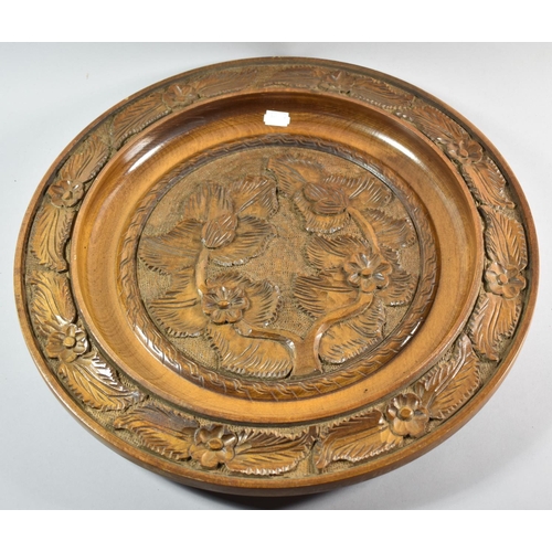 106 - A Mid 20th Century Carved Wooden Charger Decorated with Flowers and Leaves, 45cm diameter