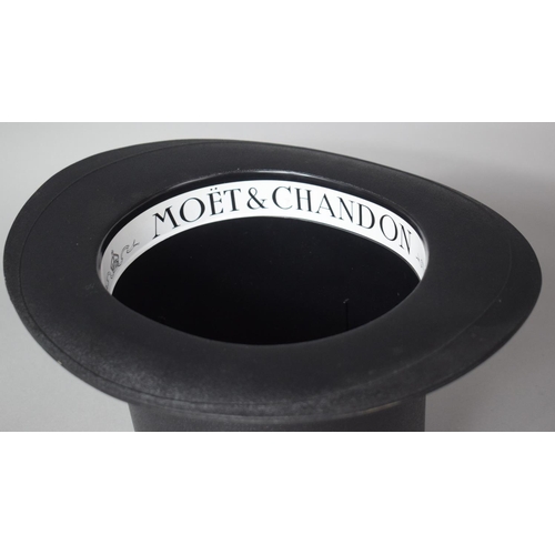 165 - A Modern Moet and Chandon Ice Bucket in the form of a Top Hat, Together with a Bottle of Sparkling W... 