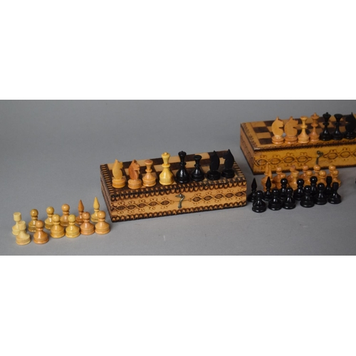 177 - Two Mid 20th Century Travelling Wooden Chess Sets in Pokerwork Decorated Boxes