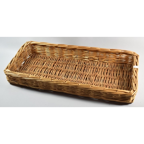 72 - A Wicker Tray, 66cm high