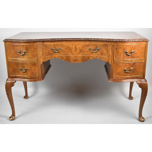 121 - A Mid 20th Century Burr walnut Serpentine Front Kneehole Writing Desk with Centre Drawer Flanked by ... 