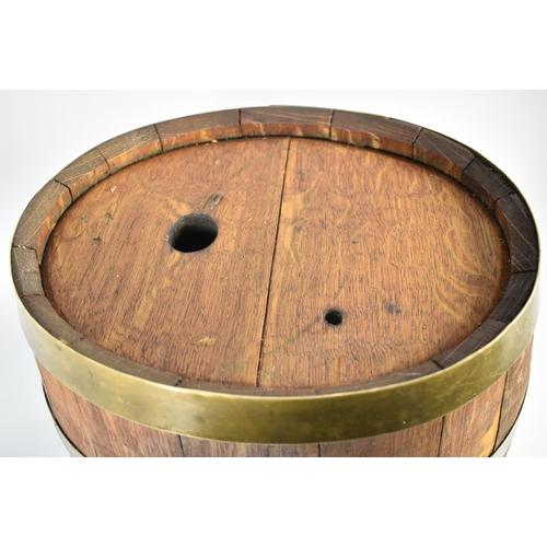 129 - An Oval Coopered Wooden Barrel with Brass Strapwork and Brass Tap, 38cm high