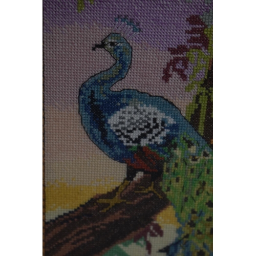 289 - A Framed Embroidery Depicting Peacock in Tree, 43cm high