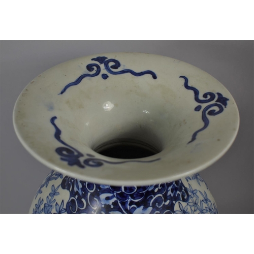 367 - A 19th Century Chinese Blue and White Vase Decorated with Flowers and Trees, 46cm high