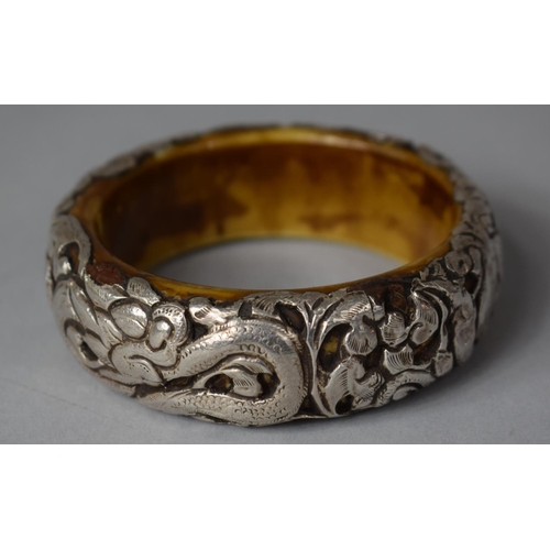 376 - A Vintage Chinese Bangle Having White Metal Overlay Depicting Dragon, 8.5cm diameter