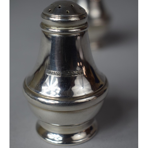 384 - A Pair of Silver Salt and Pepper Pots, Birmingham 1987, 6cm high