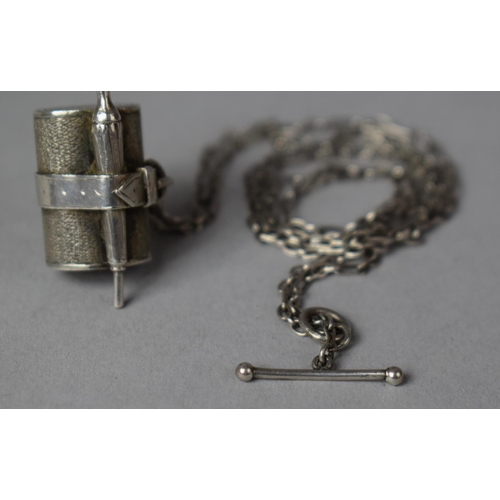 422 - A White Metal Charm Depicting Umbrella and Rolled Picnic Blanket on an Early T Bar Silver Chain