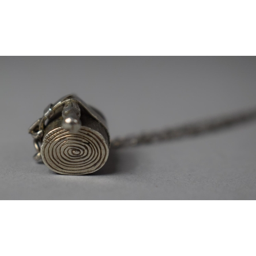 422 - A White Metal Charm Depicting Umbrella and Rolled Picnic Blanket on an Early T Bar Silver Chain