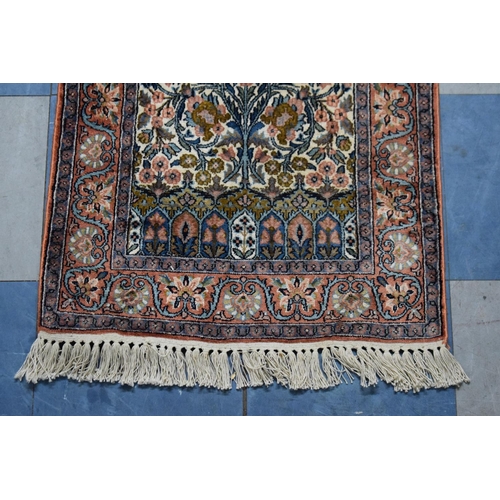 509 - A Small Rectangular Silk Rug, 106x59cm