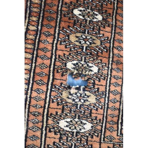 529 - A Patterned Woollen Rug, Some Tears and One Hole, 160x91cm