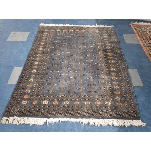 533 - A Patterned Woollen Rug on Blue Ground, 197x127cm