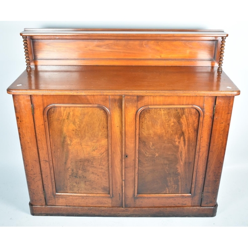 61 - A Victorian Mahogany Chiffonier with Raised Galleried Display Shelf having Turned Supports and Panel... 