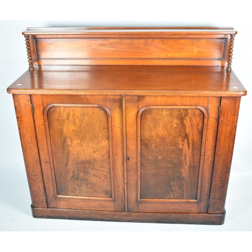 61 - A Victorian Mahogany Chiffonier with Raised Galleried Display Shelf having Turned Supports and Panel... 