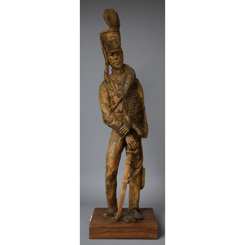 81 - A Carved Wooden Figure on Plinth Base, Inscribed 'Hussar 1805' and Monogrammed MG, 53.5cm high