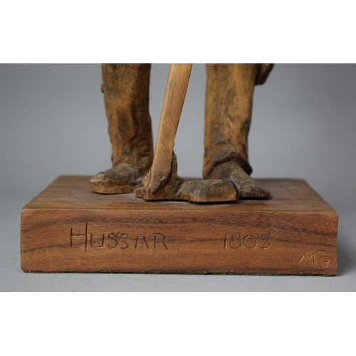 81 - A Carved Wooden Figure on Plinth Base, Inscribed 'Hussar 1805' and Monogrammed MG, 53.5cm high