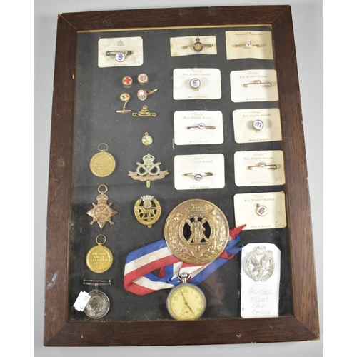 104 - A Table Top Bijouterie Case Containing Various Enamel Badges, Brooches, Cufflinks, Together with RAF... 