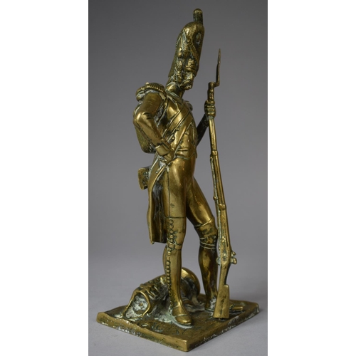 107 - A Moulded Brass Study of a Napoleonic Soldier, 24.5cm high