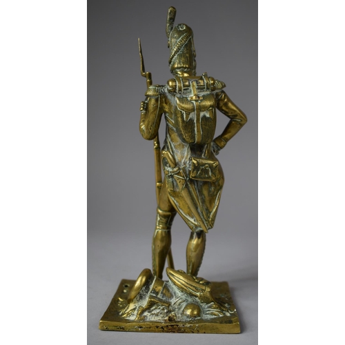 107 - A Moulded Brass Study of a Napoleonic Soldier, 24.5cm high