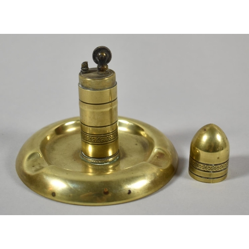 110 - A Trench Art Brass Combination Lighter/Ashtray on Circular Base, 10cm Diameter