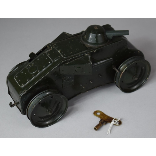 112 - A Triang Toys Clock Work Tank, with Key and Working but Missing Original Rubber Tracks, 24cm long