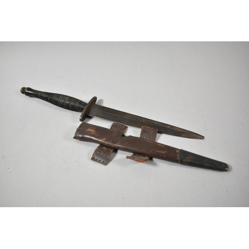 115 - A WWII Commando Dagger with Leather Scabbard, Blade Tip Missing